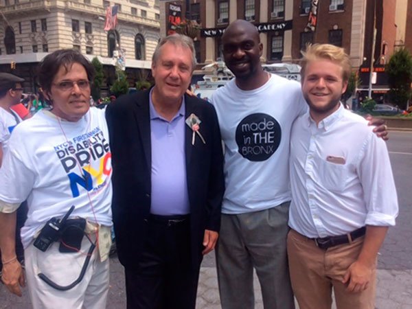 (l-r) Michael Schweinsburg, executive director of the Disability Pride NYC, councilman Danny Dromm, Blake and Brogan McGowen during the parade.