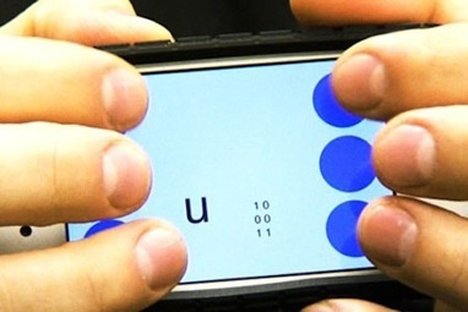 Hands on smart phone using braille Photo from Georgia Tech