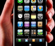 Hand holding phone showing apps