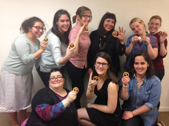 9 women holding the Thunder Bolt icon