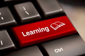 Red computer key with Learning written on it