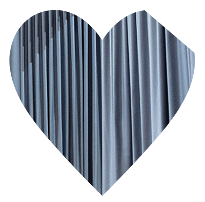 Renata Lucas "farsa" Blue heart with part of the top left cut off.The blue looks like fabric