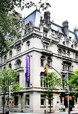 The Jewish Museum building. A banner with Jewish Museum hangs on the corner of the building.