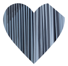 Blue heart with part of the top left cut off.The blue looks like fabric