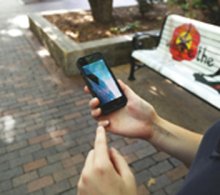 Woman outside with smartphone