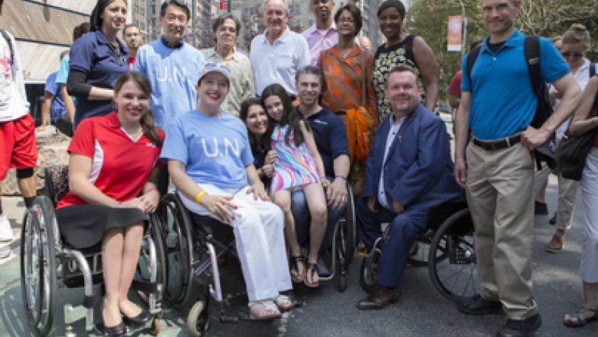 Participants in the parade gather together to march