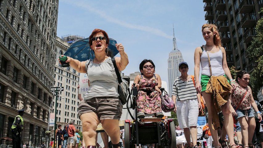 Michelle Kraus chants while she takes part in New York's first Disability Pride parade