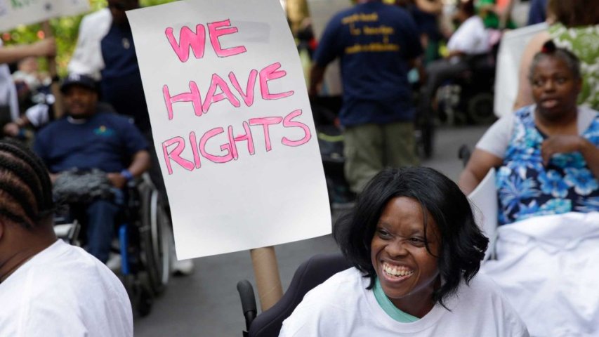 A group of people holding a sign saying "We have rights"