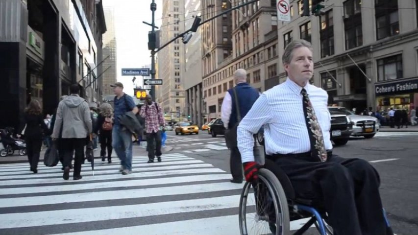 Man in wheelchair in downtown Manhattan