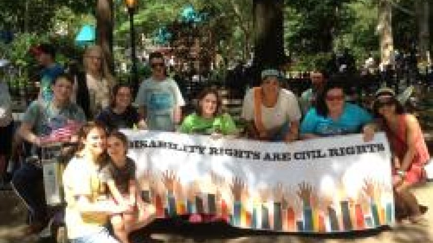 Participants in the parade gather together to march